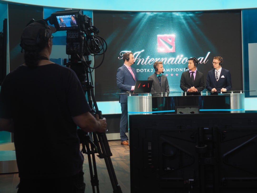 three-men-in-suits-being-filmed-for-dota-2-competition-yehv9k3ynx8